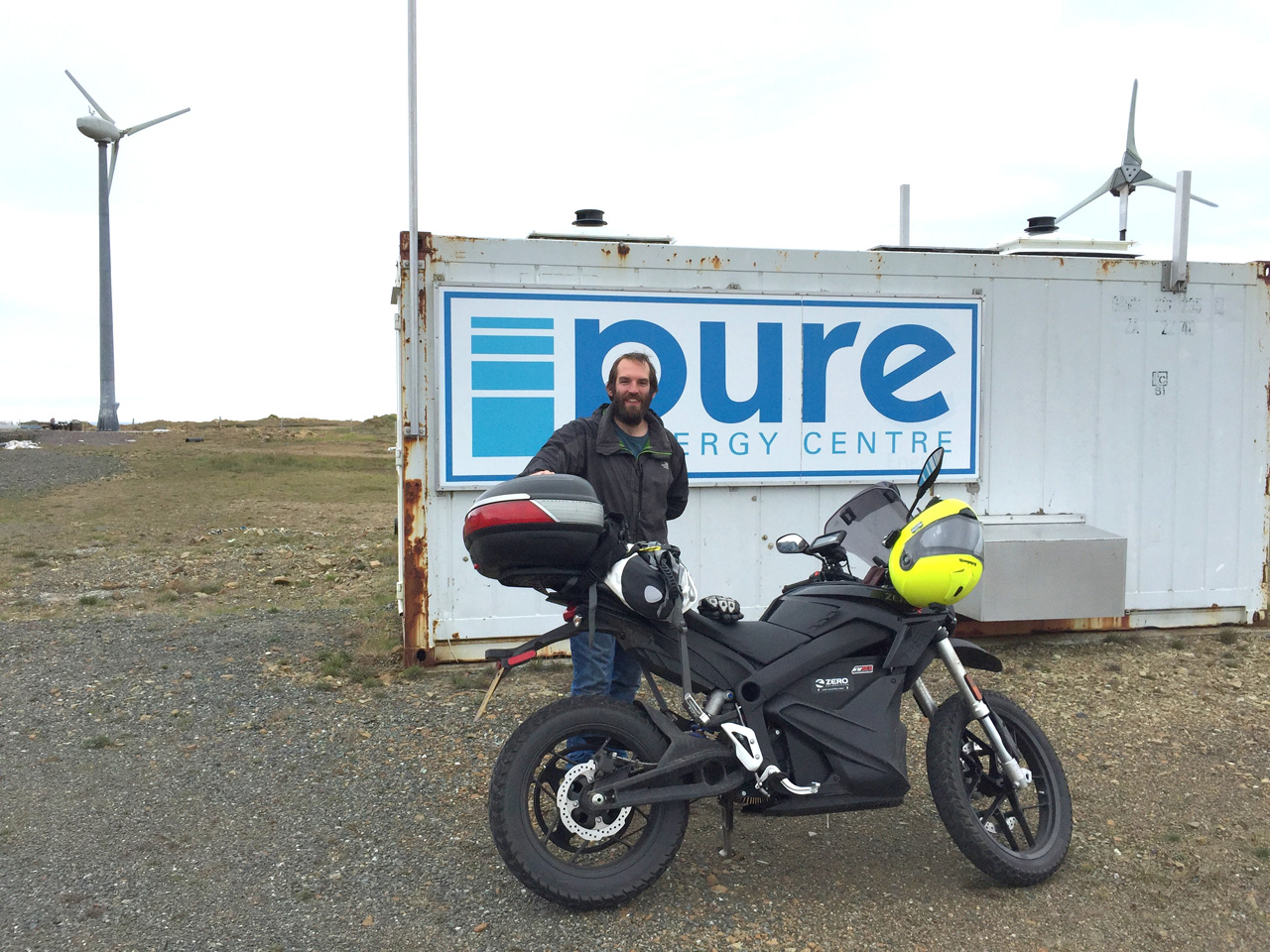 Ross Gazey of the Pure Energy Centre with John Chivers' Zero DSR electric motorcycle at the Pure Energy Centre, Unst, Shetland.